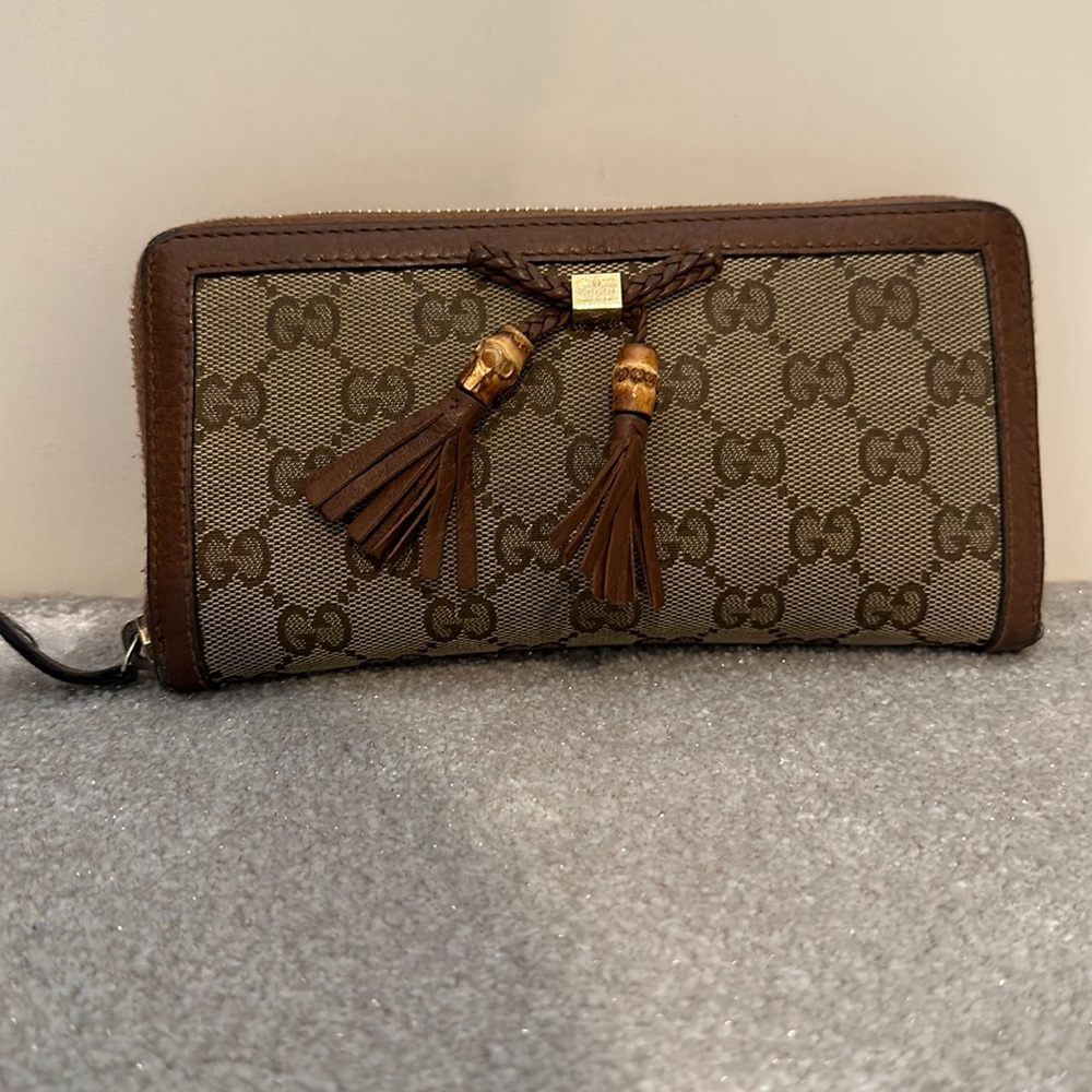 Authentic Gucci logo tassel wallet